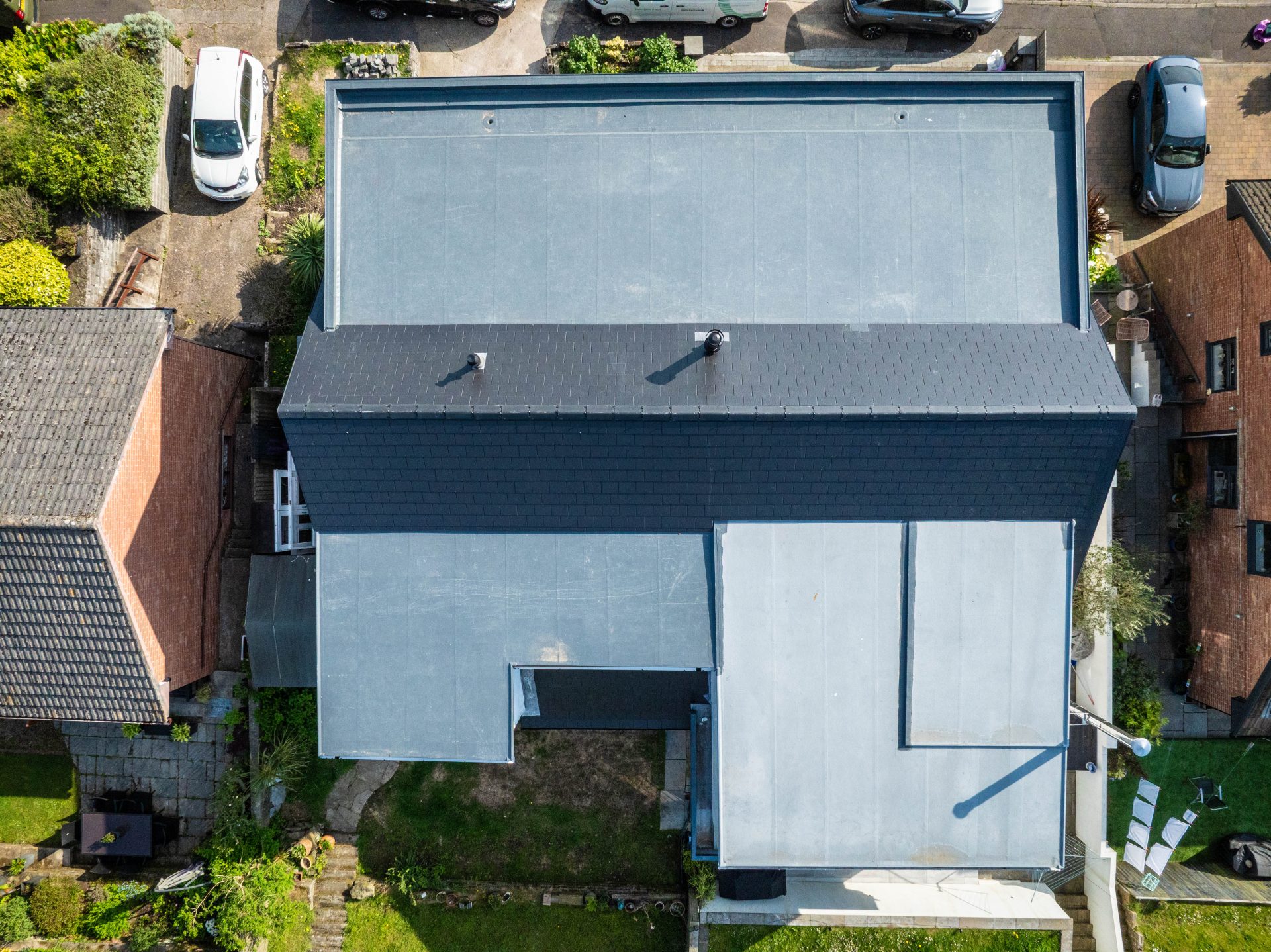Birds eye view of a double house renovation in Mumbles Swansea High-end residential refurbishment aftercare in South Wales showcasing natural materials, open-plan living and detailed craftsmanship