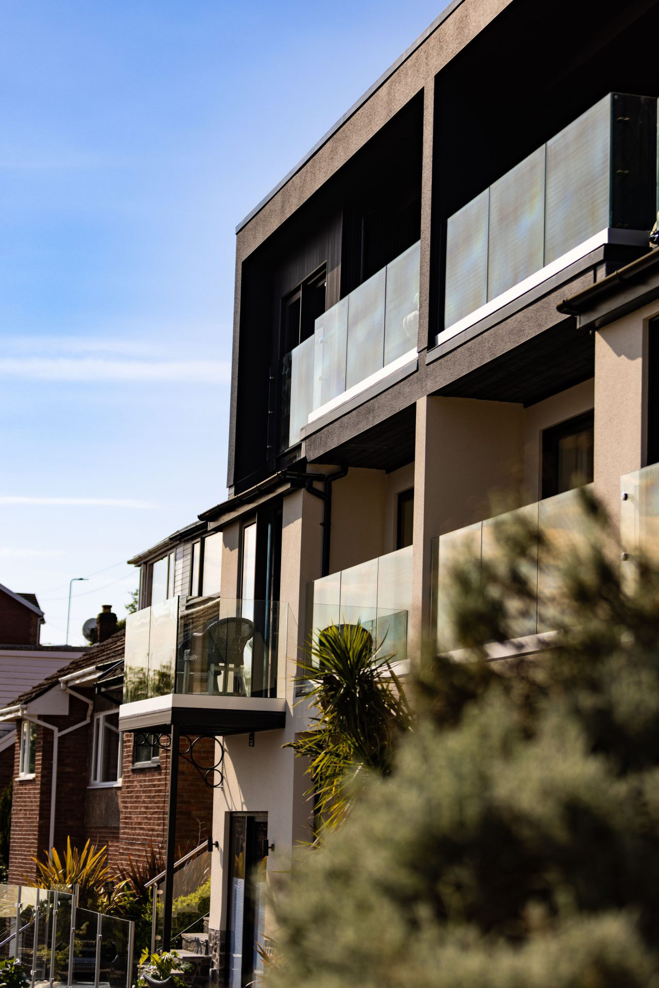 Finished contemporary new build home with glass balconies overlooking Swansea Bay